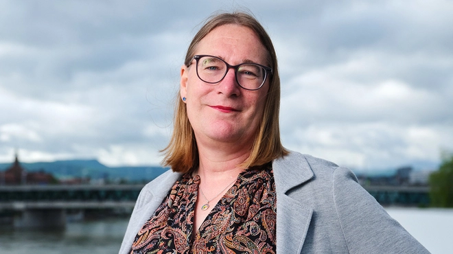 A portrait of Stephie, Global Head of diversity, equity, and inclusion, responsible for disability equity at Novartis