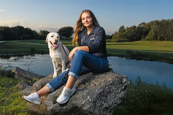 Kate Kostelyk, IgA nephropathy (IgAN) patient, and her labrador Dakoda in Mims, Florida